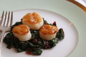 Seared Scallops with a Maple Miso Glaze over Swiss Chard Seared Scallops with a Maple Miso Glaze over Swiss Chard